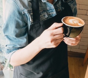 Person holding coffee mug